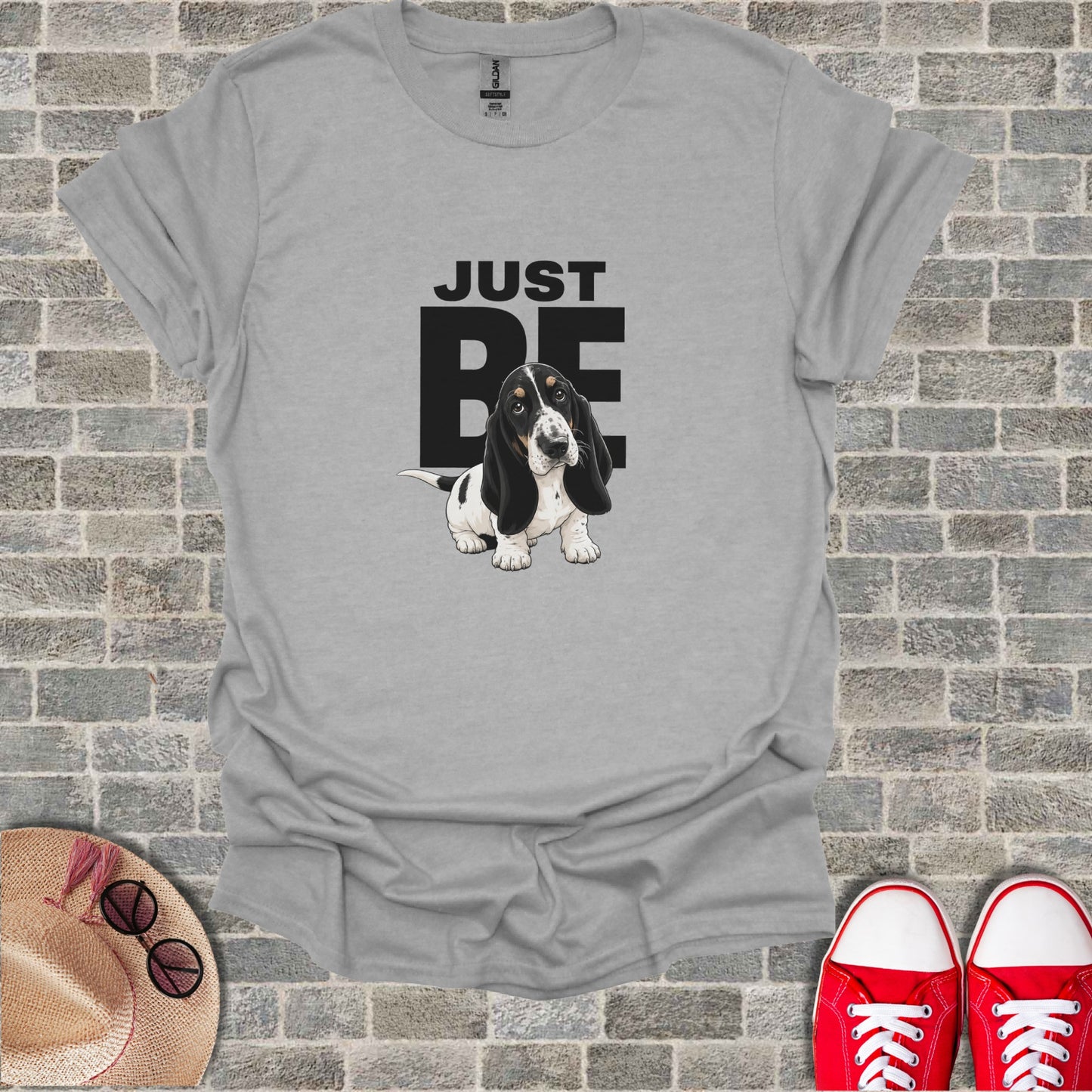 Gray t-shirt with "JUST BE" text and a basset hound dog illustration.