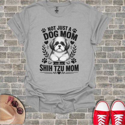 Grey t-shirt with "Not Just a Dog Mom... A Shih Tzu Mom" and Shih Tzu illustration.