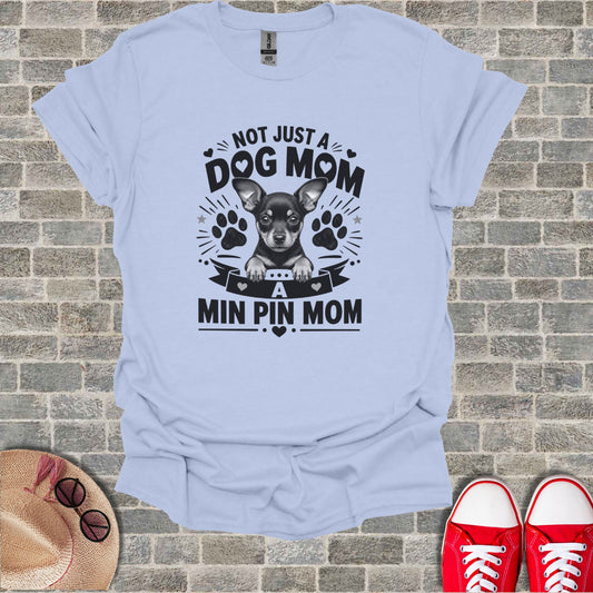 Light blue t-shirt with "Not Just A Dog Mom" and a Chihuahua graphic.