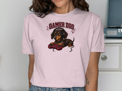 Dachshund wearing headphones and holding a video game controller.