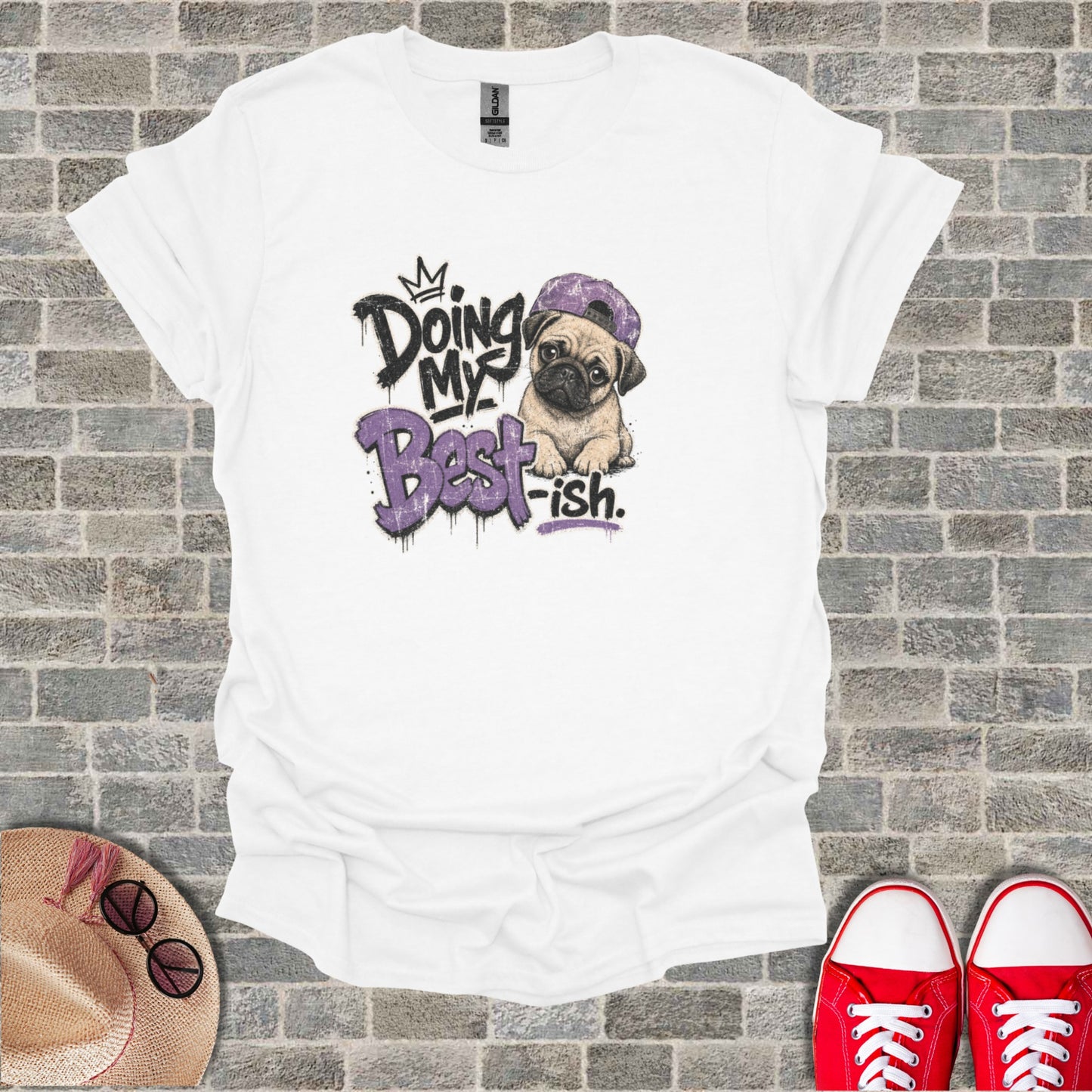White t-shirt with graphic of pug wearing a backwards baseball cap.