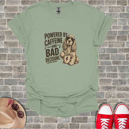 T-shirt with graphic of dog wearing sunglasses drinking coffee, text reads "Powered by caffeine and bad decisions."