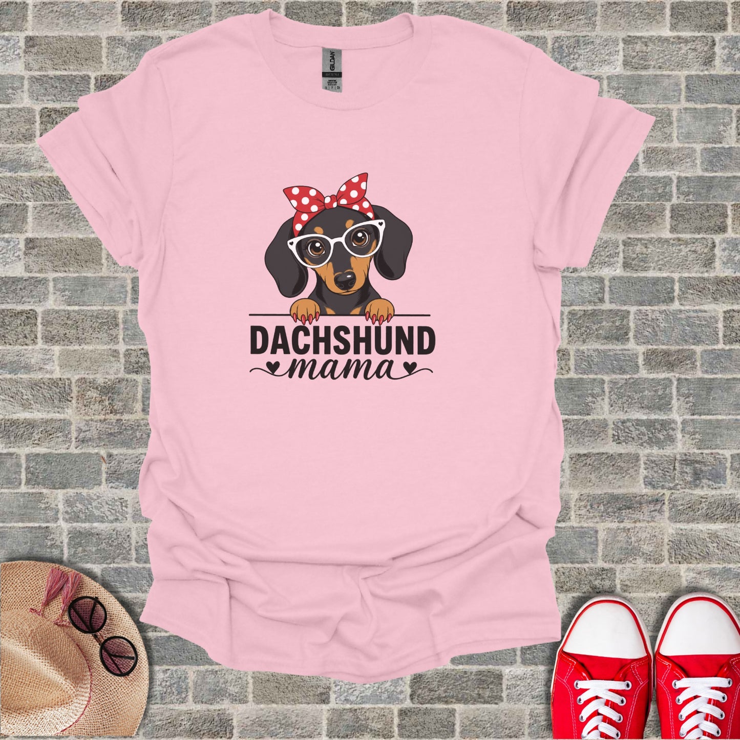 Pink t-shirt with "Dachshund Mama" graphic featuring a dachshund wearing glasses.