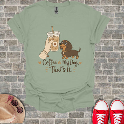 Light green t-shirt with dachshund and coffee cup graphic and text.