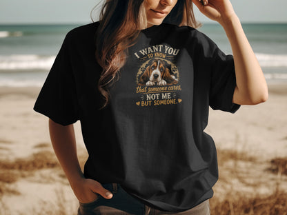 Black t-shirt with Basset Hound graphic and text "I want you to know that someone cares, not me - but someone."