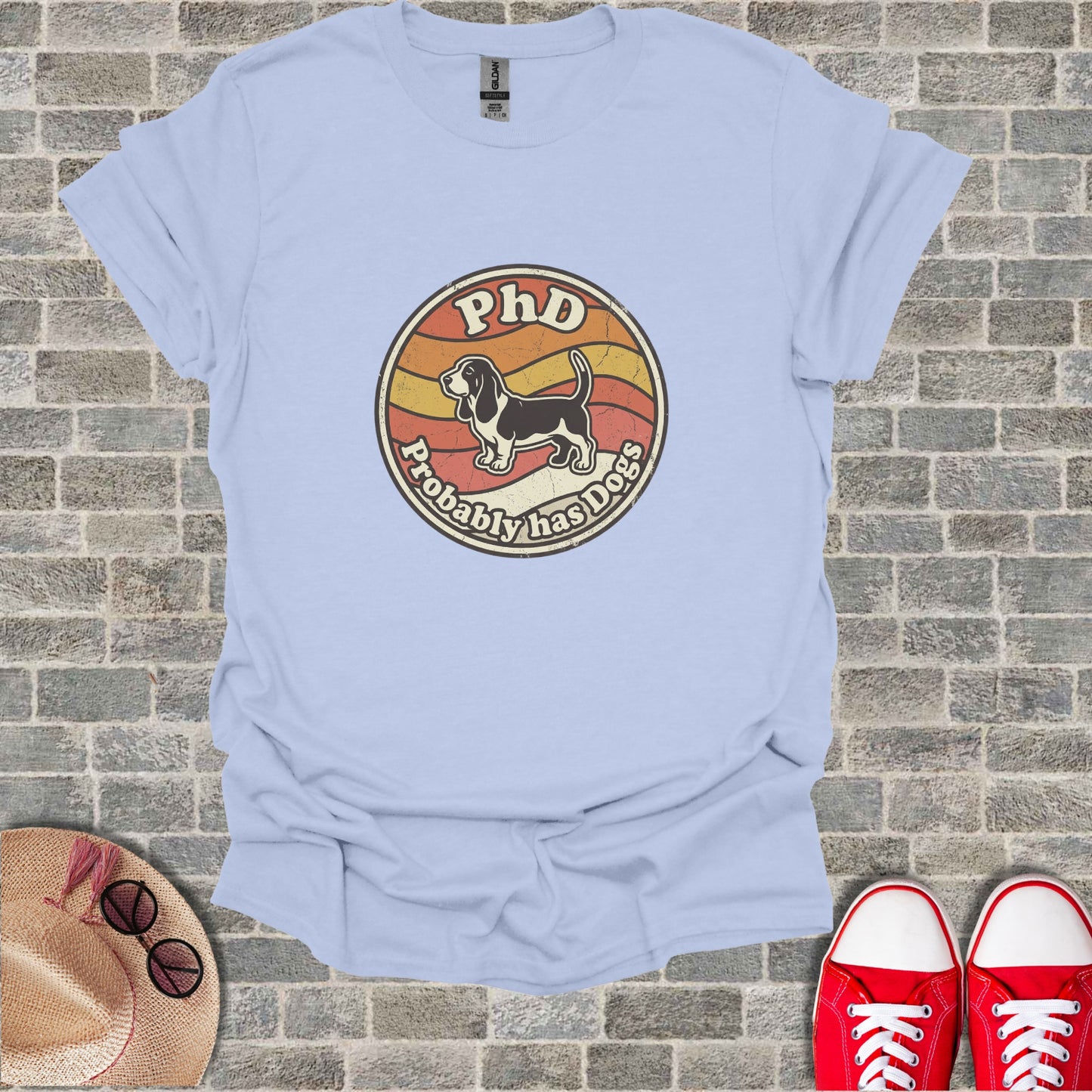 T-shirt with circular graphic, "PhD Probably Has Dogs," and dog silhouette.