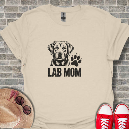 Labrador mom with paw print graphic on a tan t-shirt.