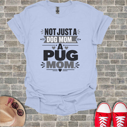 Light blue t-shirt with "Not Just a Dog Mom... A Pug Mom" text design.
