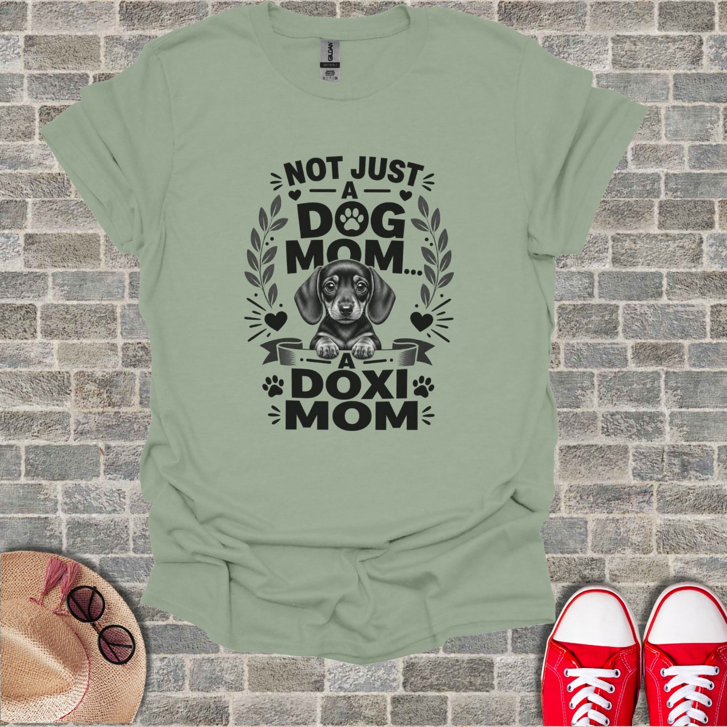 T-shirt with dachshund graphic and text "Not just a dog mom... a Doxi Mom".