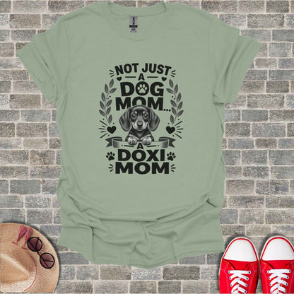 T-shirt with dachshund graphic and text "Not just a dog mom... a Doxi Mom".
