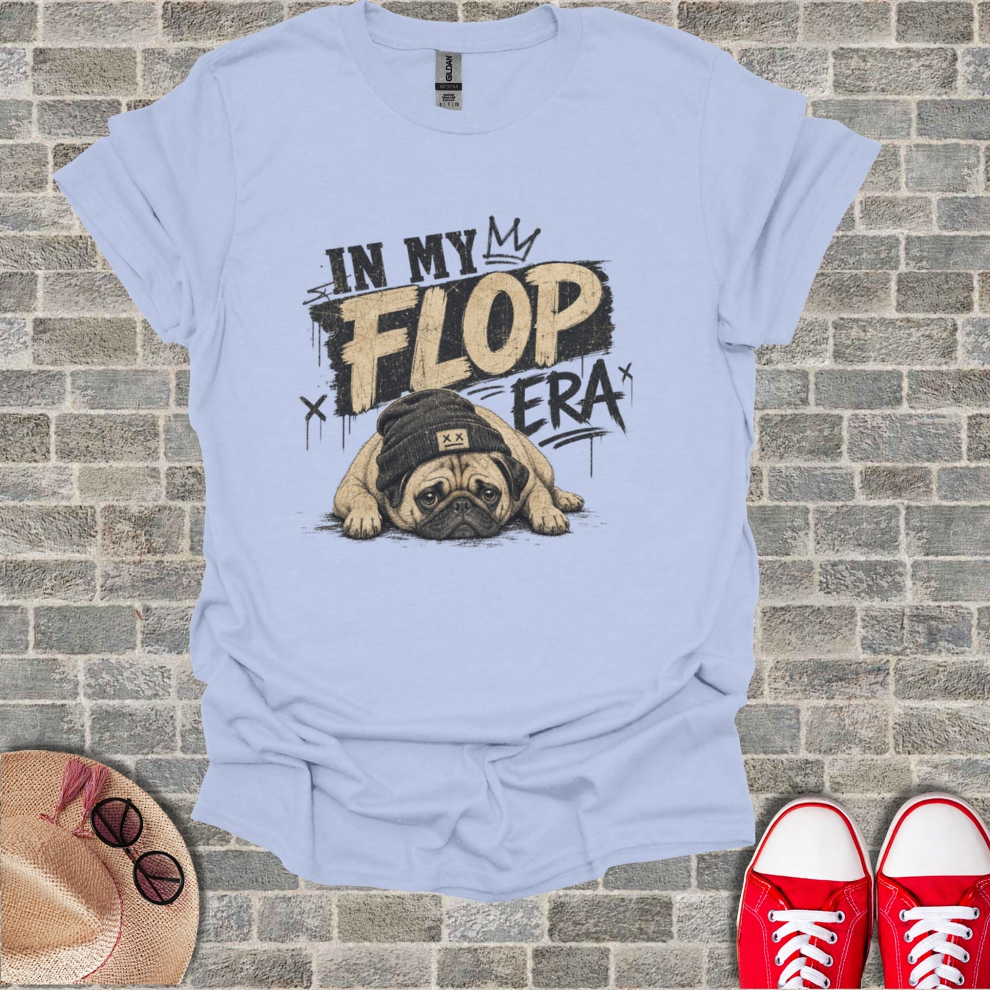 Light blue t-shirt with a pug wearing a beanie and "In My Flop Era" text.