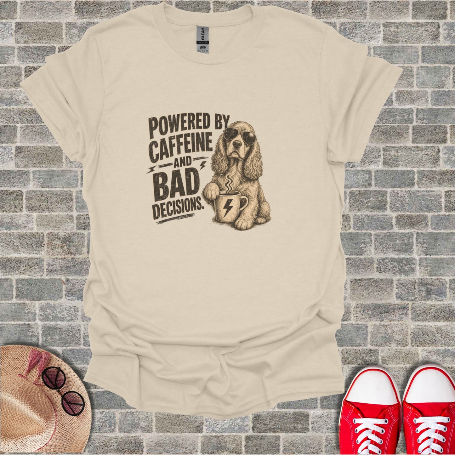 T-shirt with "Powered by Caffeine and Bad Decisions" text and a dog holding coffee.