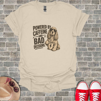 T-shirt with "Powered by Caffeine and Bad Decisions" text and a dog holding coffee.