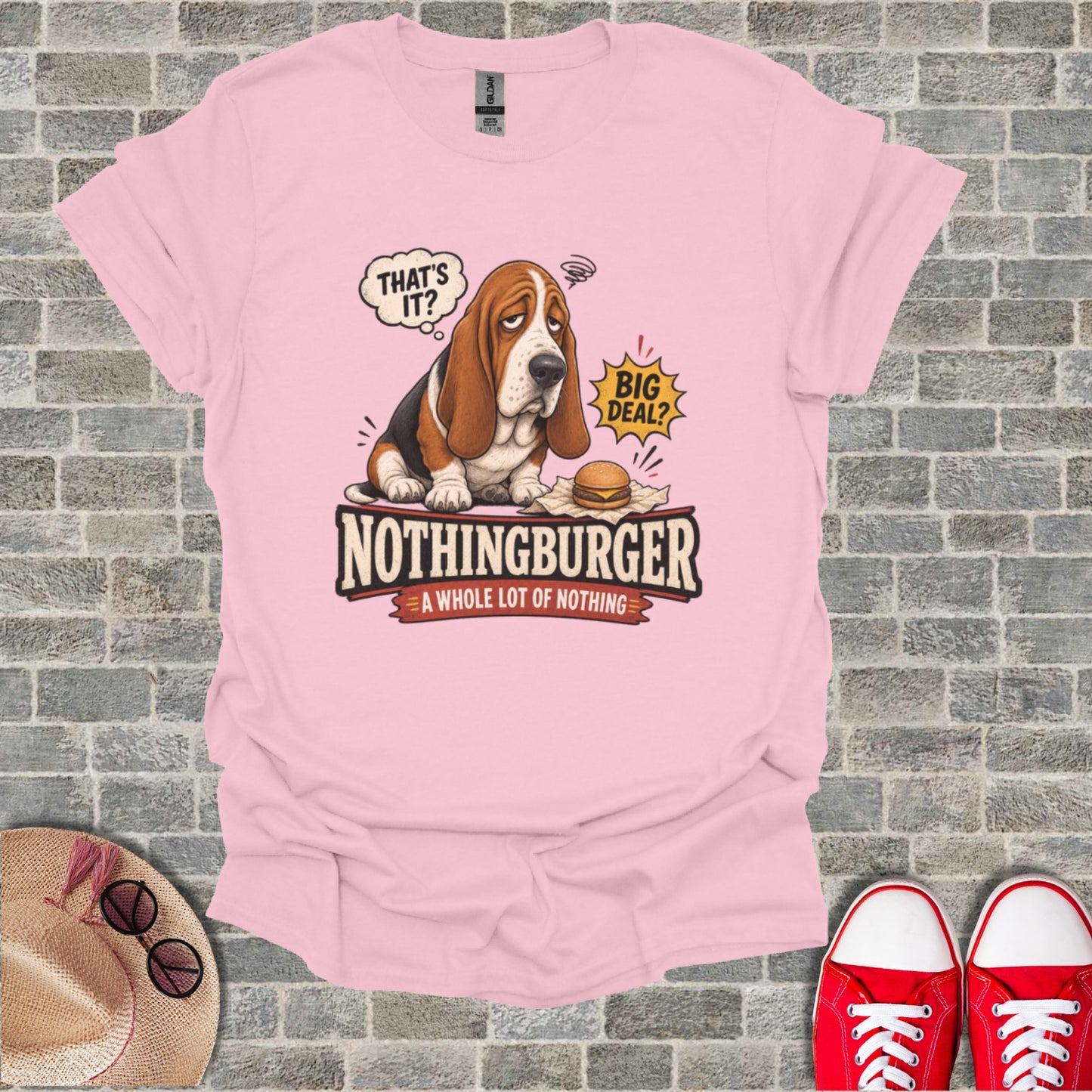 Pink t-shirt with a cartoon basset hound and text "NOTHINGBURGER A WHOLE LOT OF NOTHING".