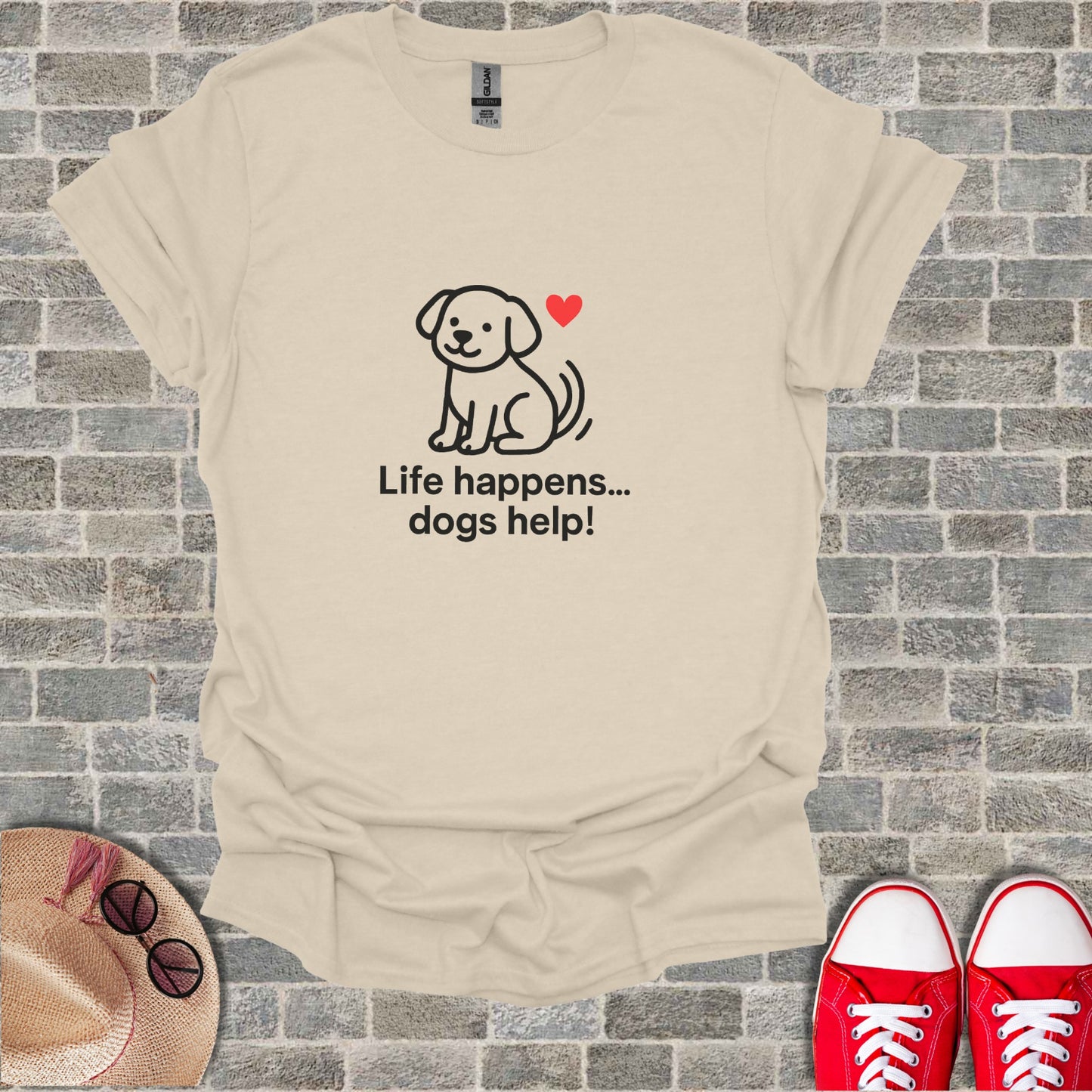 Cream t-shirt with cartoon dog and heart, reads "Life happens... dogs help!".