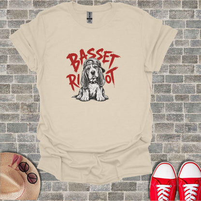 Basset Hound wearing a baseball cap, red text "Basset Riot" above.
