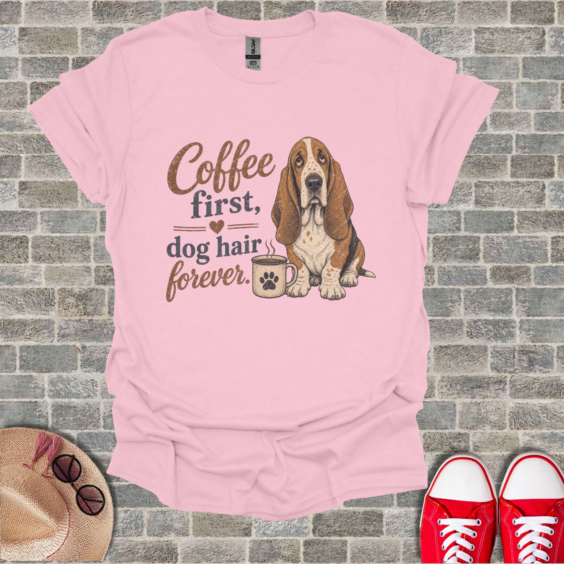 Pink t-shirt with Basset Hound, coffee mug, and text "Coffee first, dog hair forever."