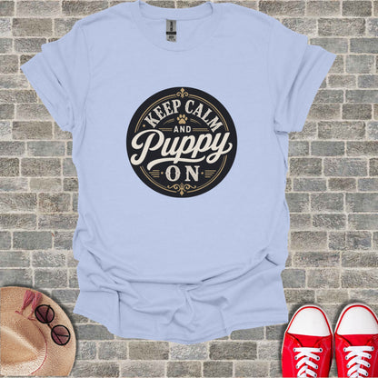 Light blue t-shirt with "Keep Calm and Puppy On" graphic.