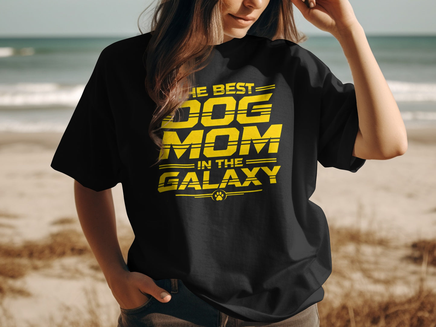 Black t-shirt with yellow text reading "THE BEST DOG MOM IN THE GALAXY" and paw print.