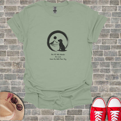 T-shirt with dog, sun, moon, and quote: "Not All Who Wander Are Lost. Some Are With Their Dog."