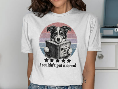 Dog wearing glasses reads "The History of Glue" on a t-shirt.
