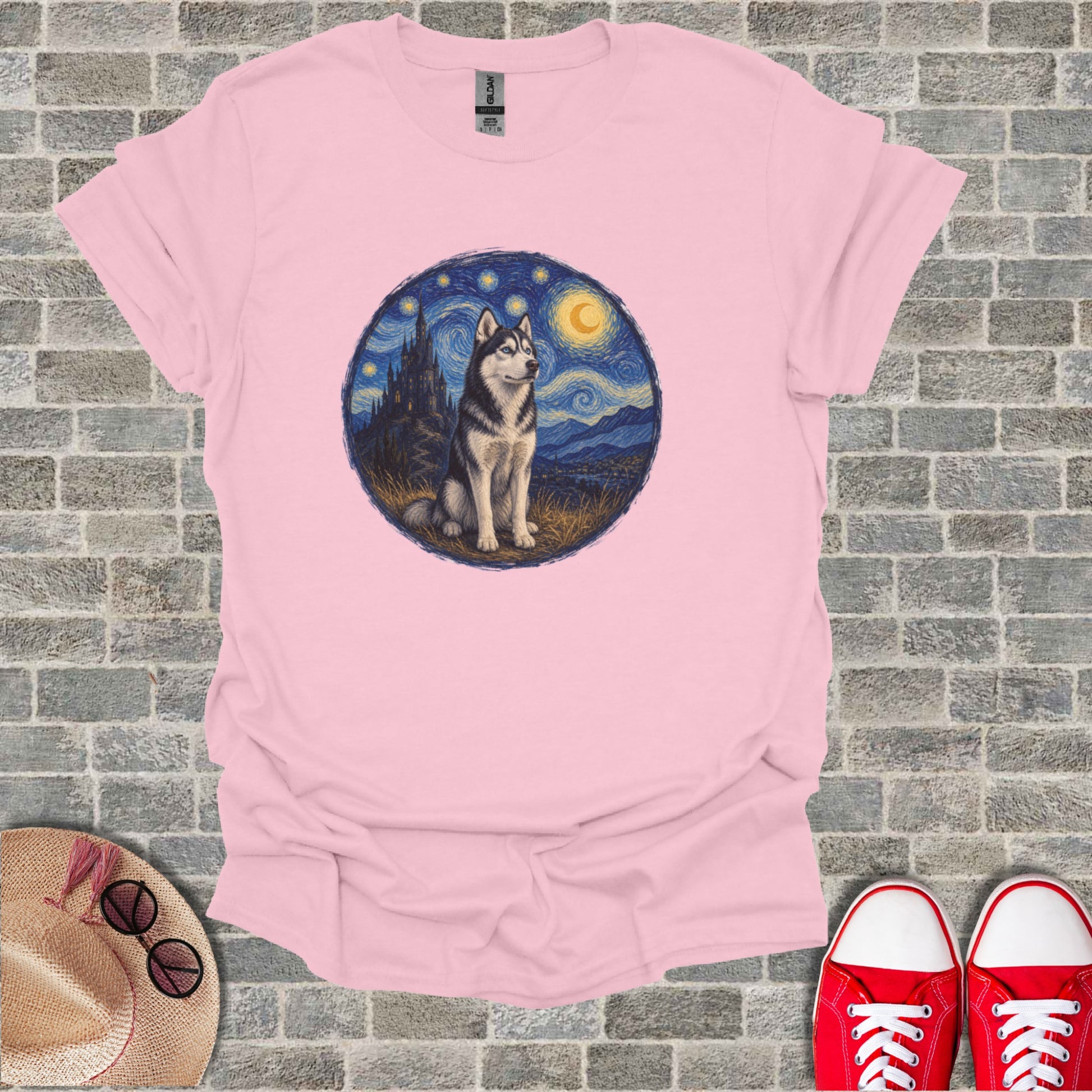Husky dog sitting under a starry night sky with a crescent moon.