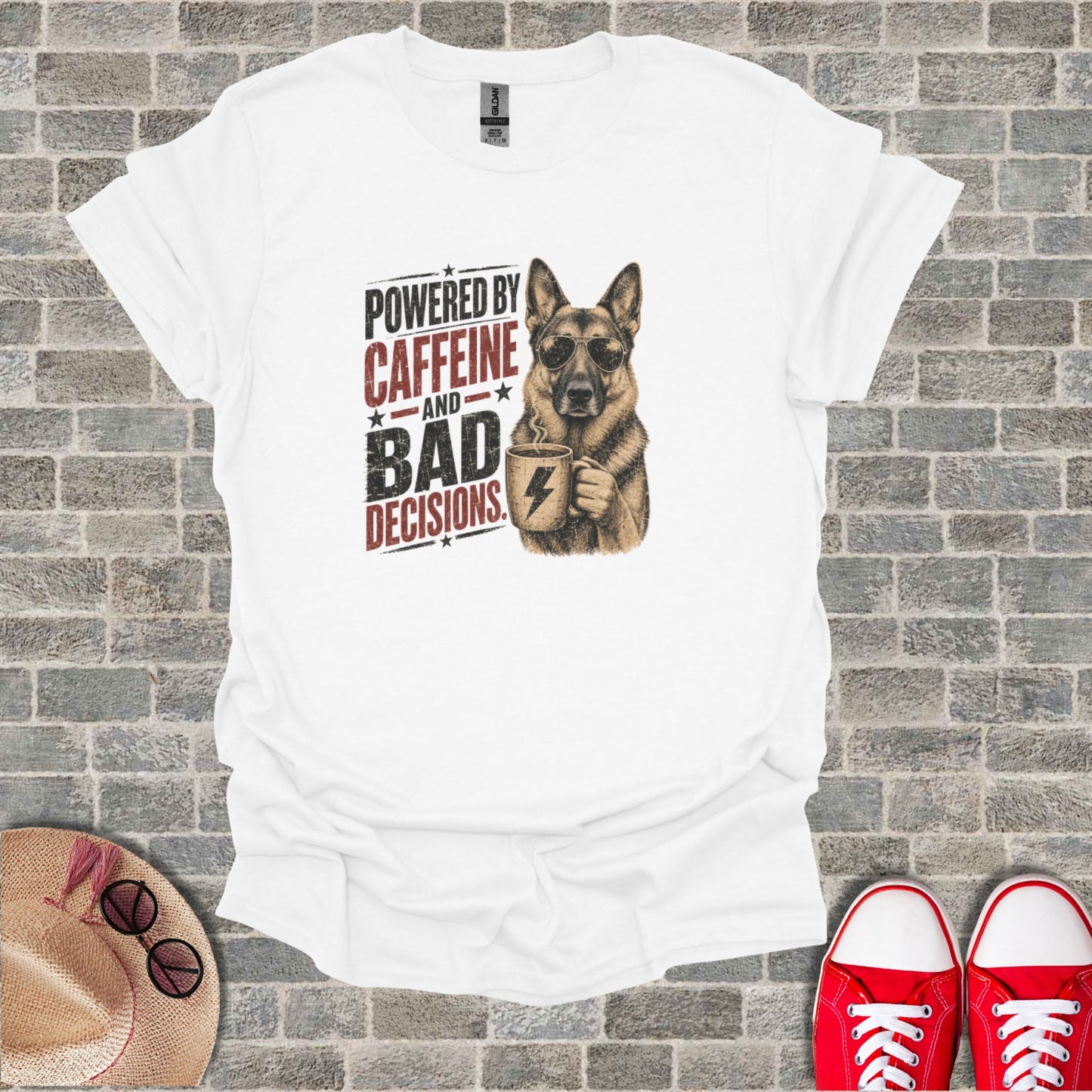 German Shepherd wearing sunglasses, holding a coffee mug, with "Powered by Caffeine and Bad Decisions" text.