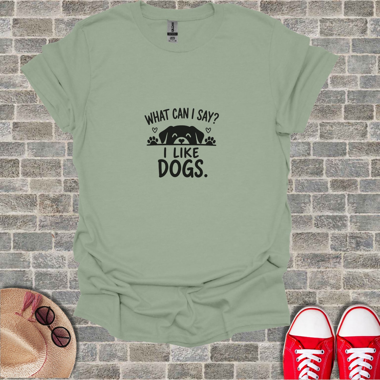 Green t-shirt with black text "WHAT CAN I SAY? I LIKE DOGS."