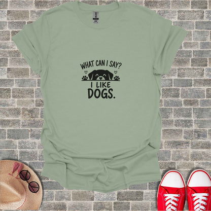Green t-shirt with black text "WHAT CAN I SAY? I LIKE DOGS."