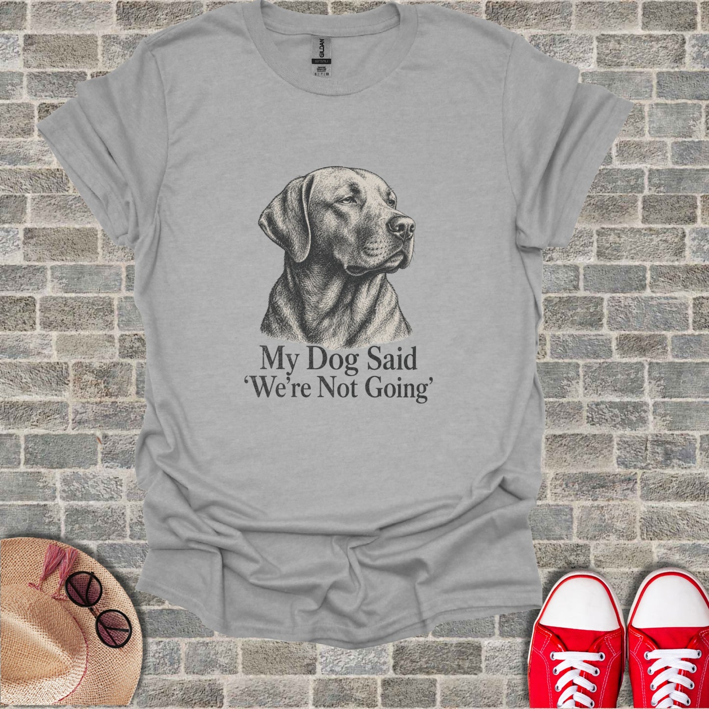 Light gray t-shirt with black sketch of a dog and text "My Dog Said 'We're Not Going'".