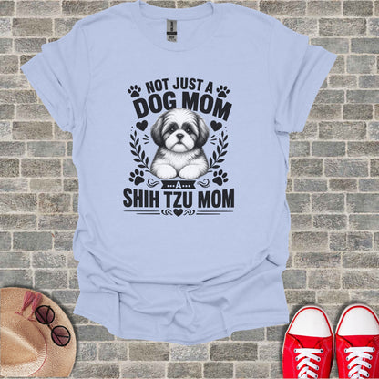 Light blue t-shirt with black graphic text "Not Just a Dog Mom... A Shih Tzu Mom".