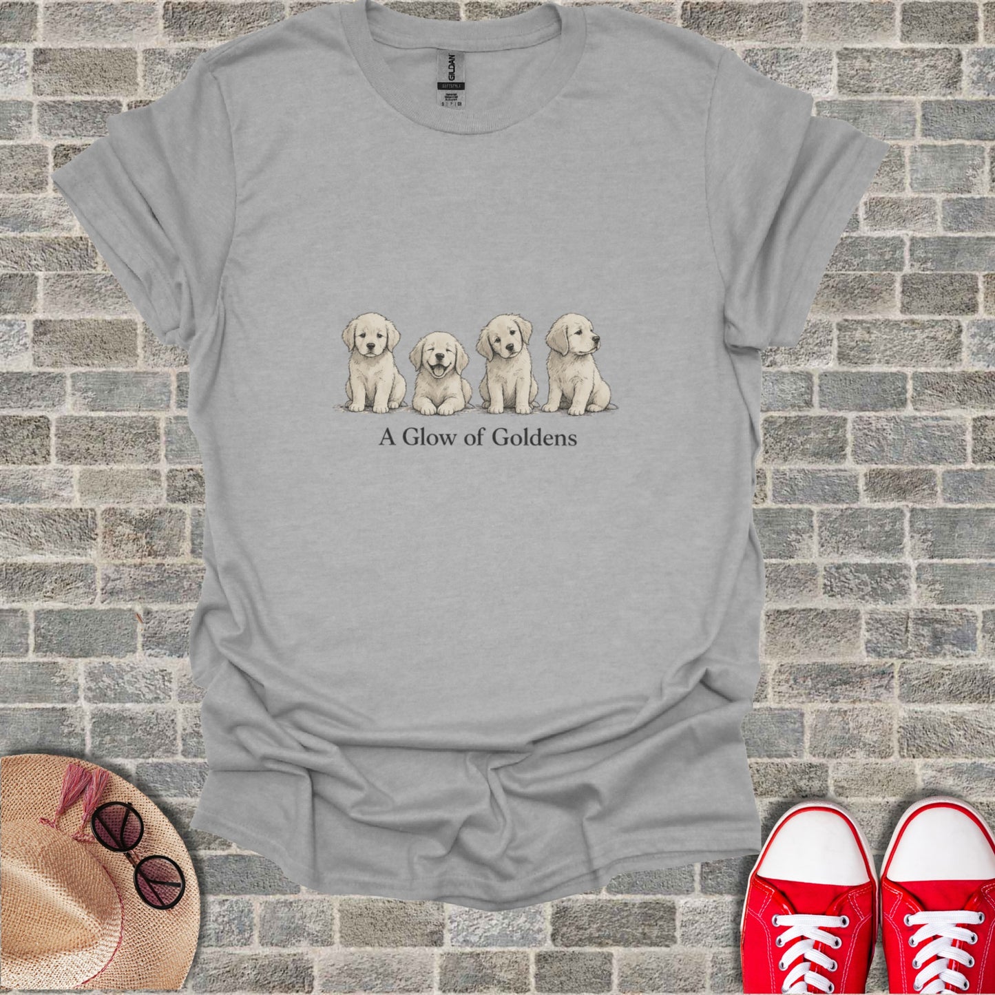 Gray t-shirt with four golden retriever puppies and the text "A Glow of Goldens."