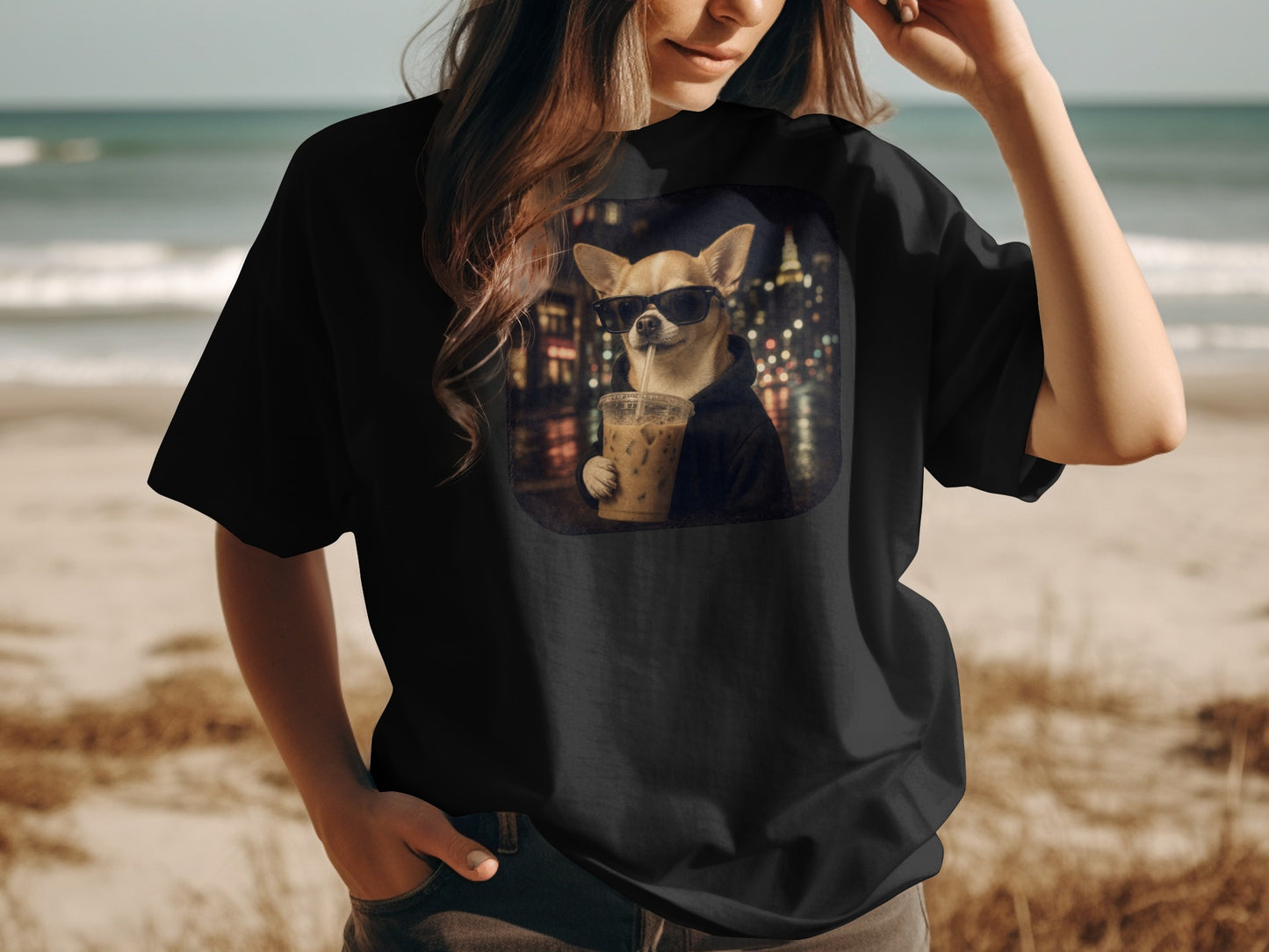 Chihuahua wearing sunglasses drinks iced coffee with city lights at night.
