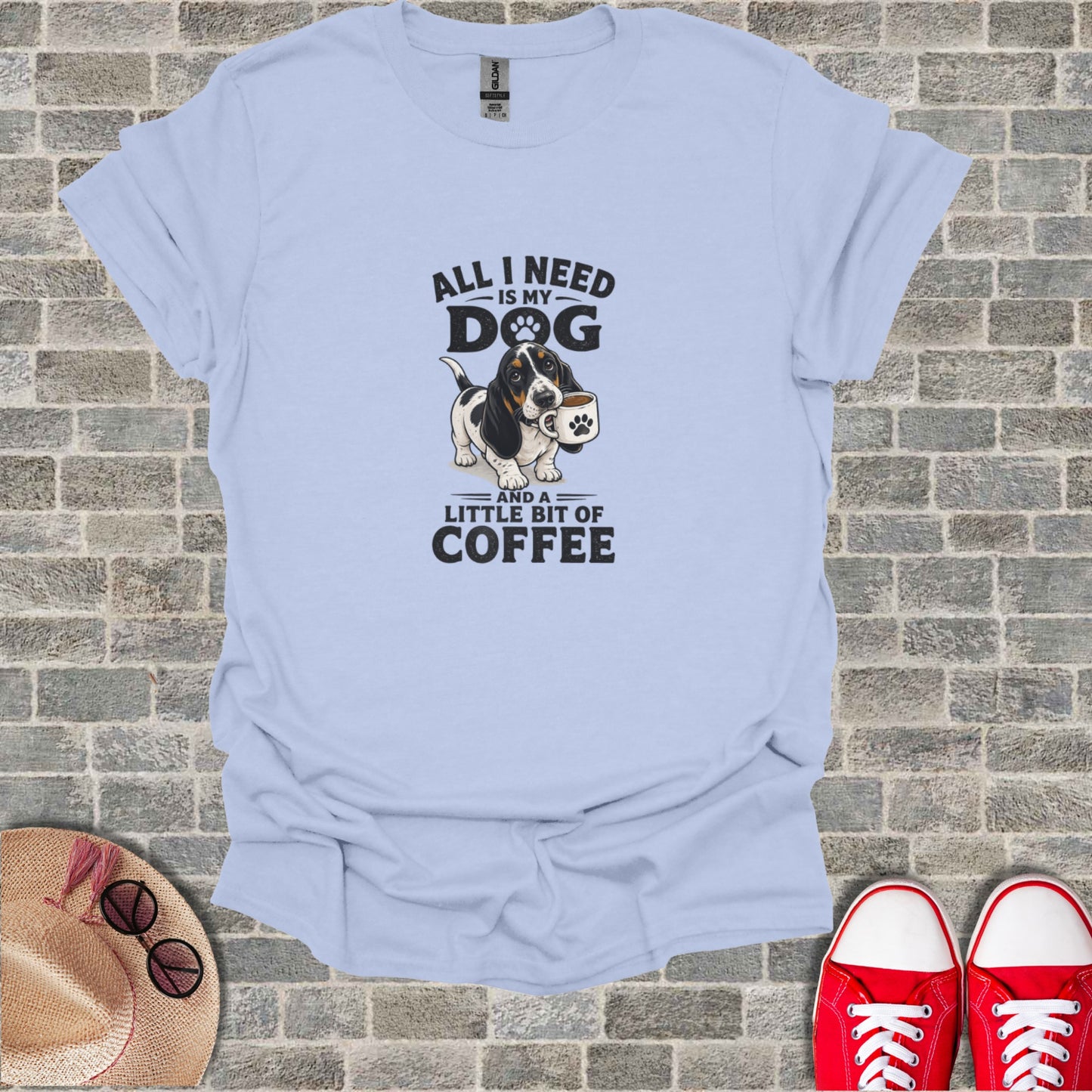 Light blue t-shirt with "All I need is my dog and a little bit of coffee" text and graphic.