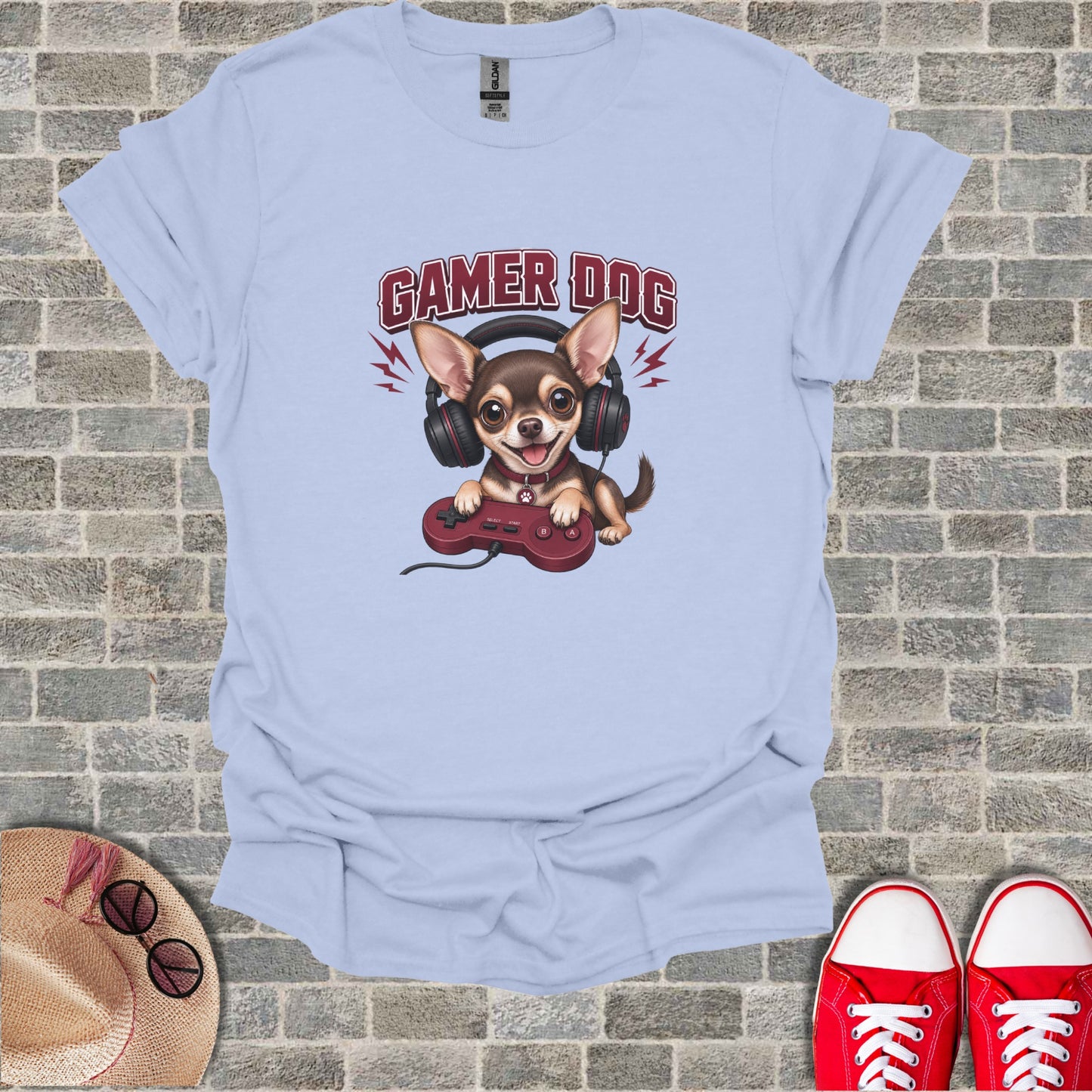 Light blue t-shirt with a cartoon dog wearing headphones and holding a video game controller.