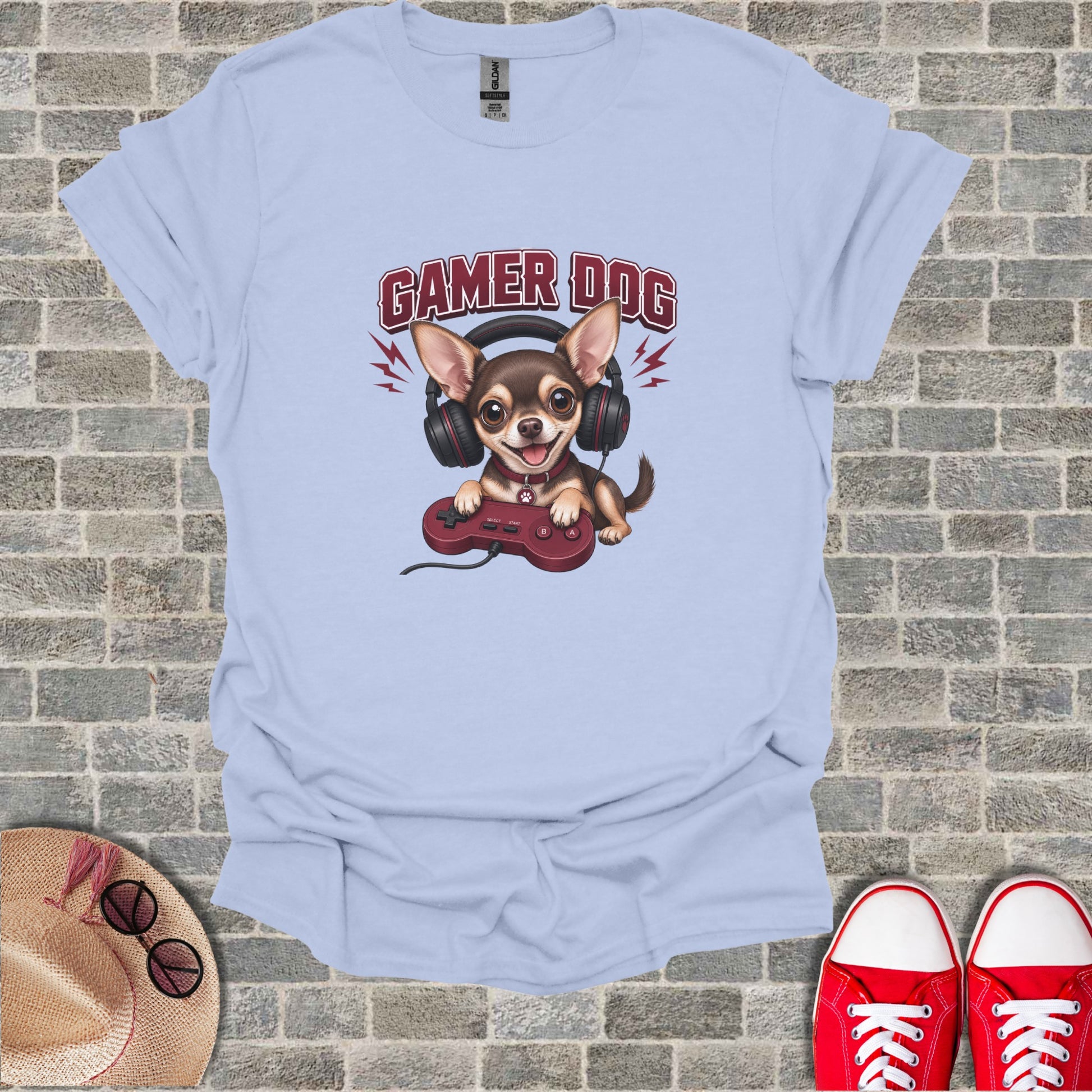 Light blue t-shirt with a cartoon dog wearing headphones and holding a video game controller.