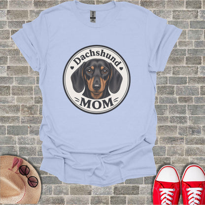 Light blue t-shirt with a graphic of a dachshund and the text "Dachshund MOM".