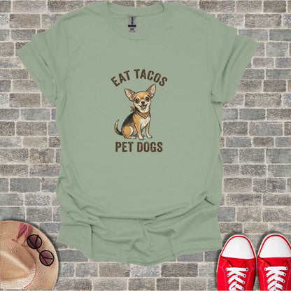 Green t-shirt with cartoon chihuahua saying "Eat Tacos Pet Dogs".