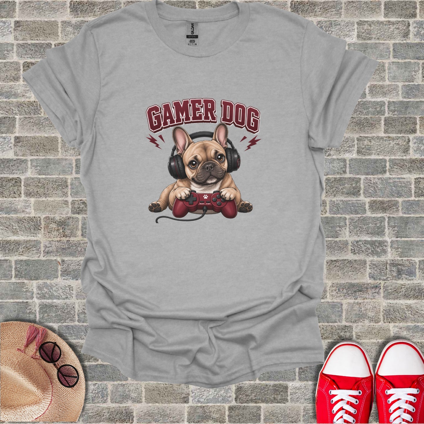 French bulldog wearing headphones and holding a video game controller.