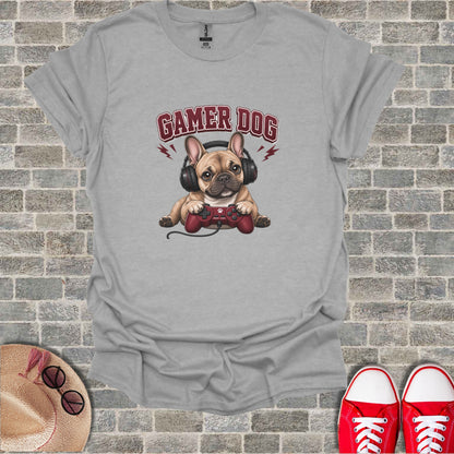 French bulldog wearing headphones and holding a video game controller.