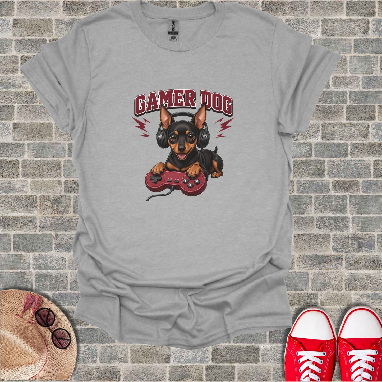 T-shirt graphic of a Chihuahua wearing headphones and holding a video game controller.