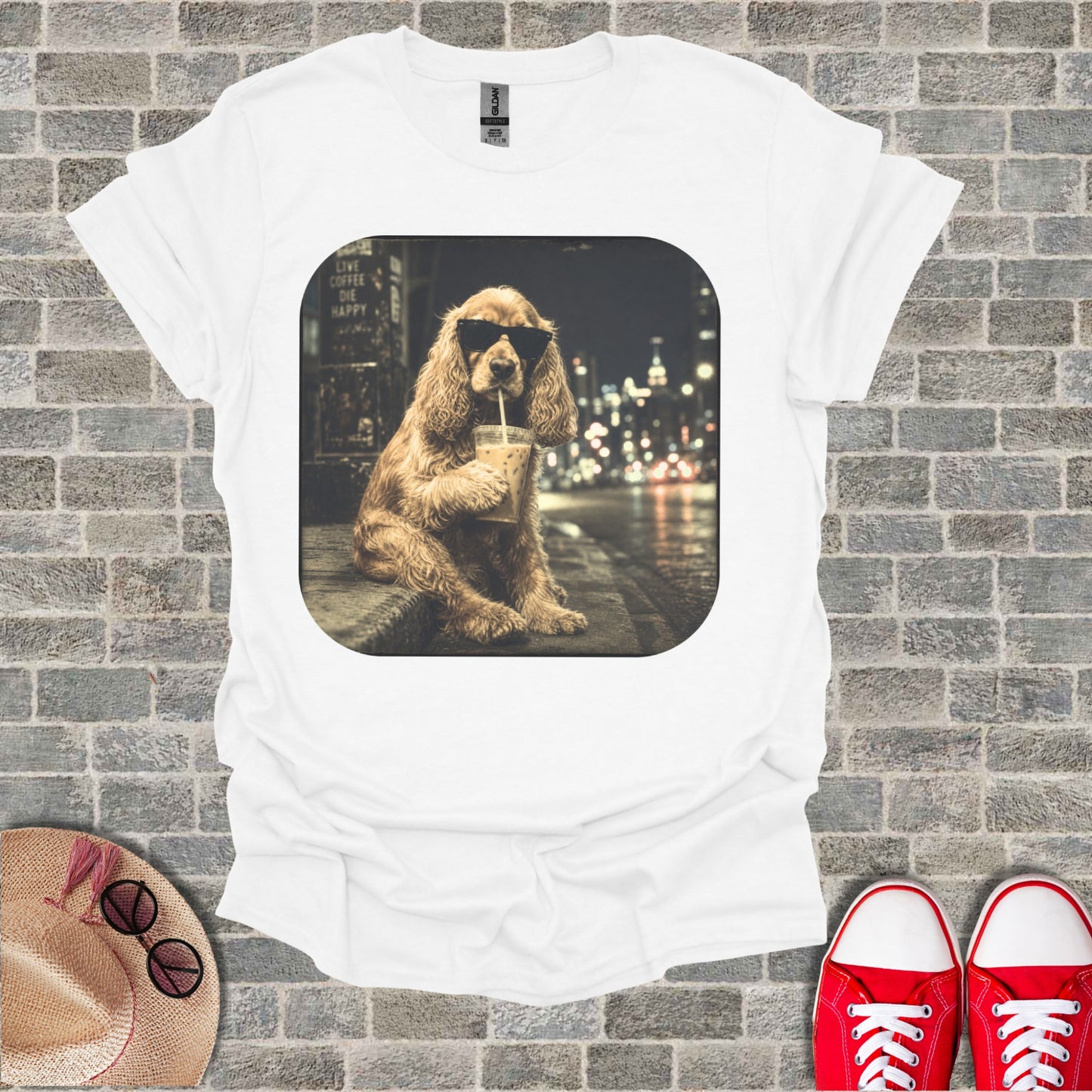 White t-shirt with a graphic of a dog wearing sunglasses drinking iced coffee.