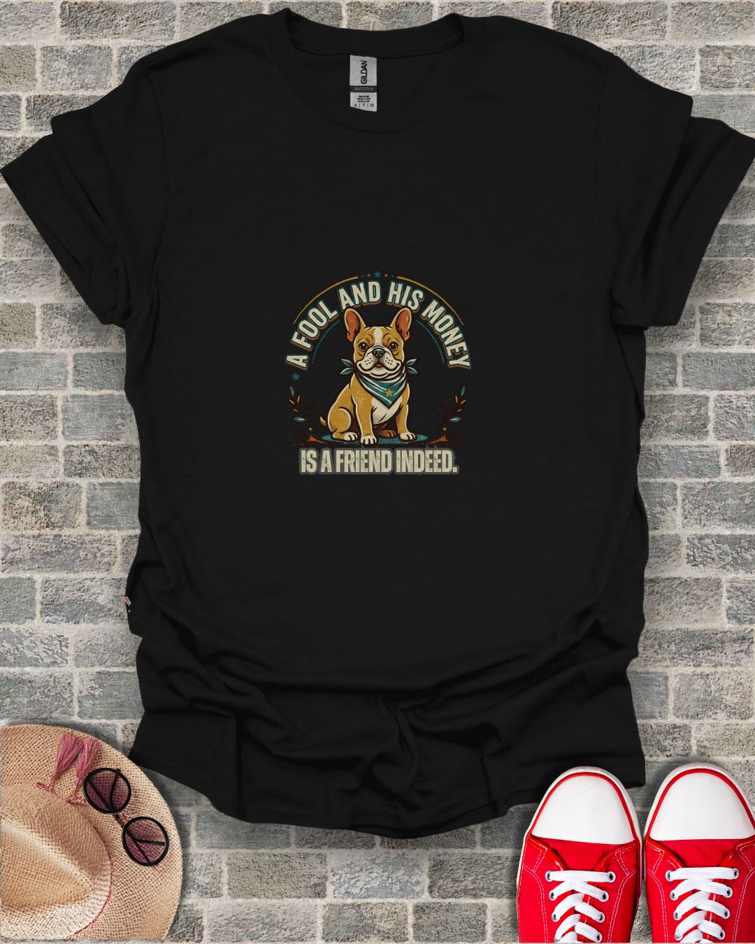 French bulldog wearing bandana with text "A fool and his money is a friend indeed."