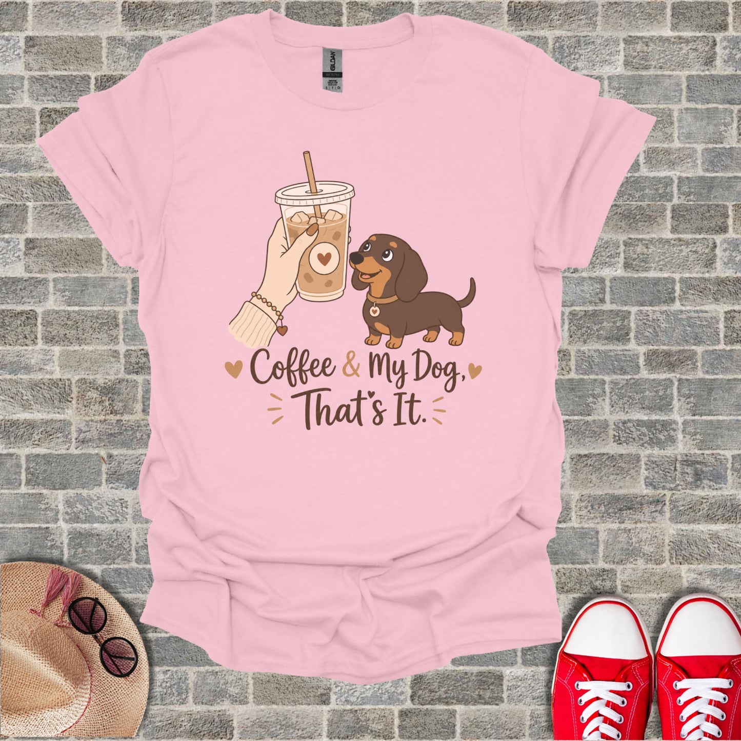 Pink t-shirt with illustration of dachshund, coffee cup, and text "Coffee & My Dog. That's It."