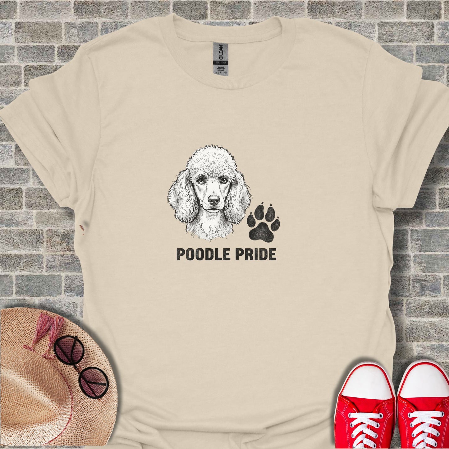 Cream t-shirt with a black poodle and paw print graphic and text.