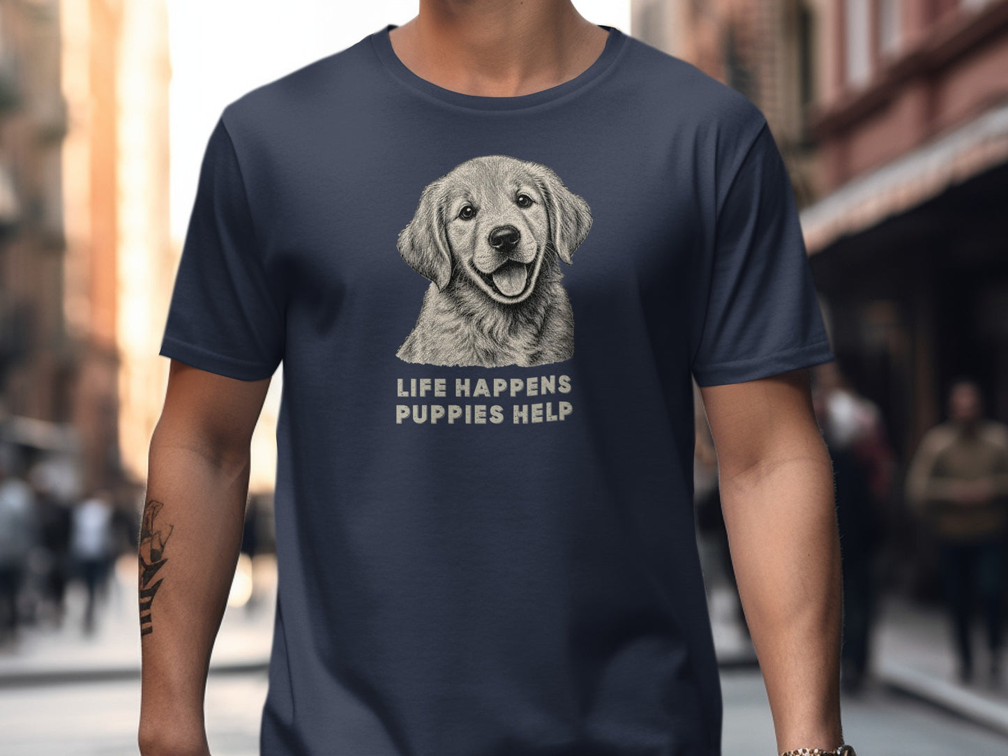 Dark navy t-shirt with a smiling golden retriever drawing and text: LIFE HAPPENS PUPPIES HELP.