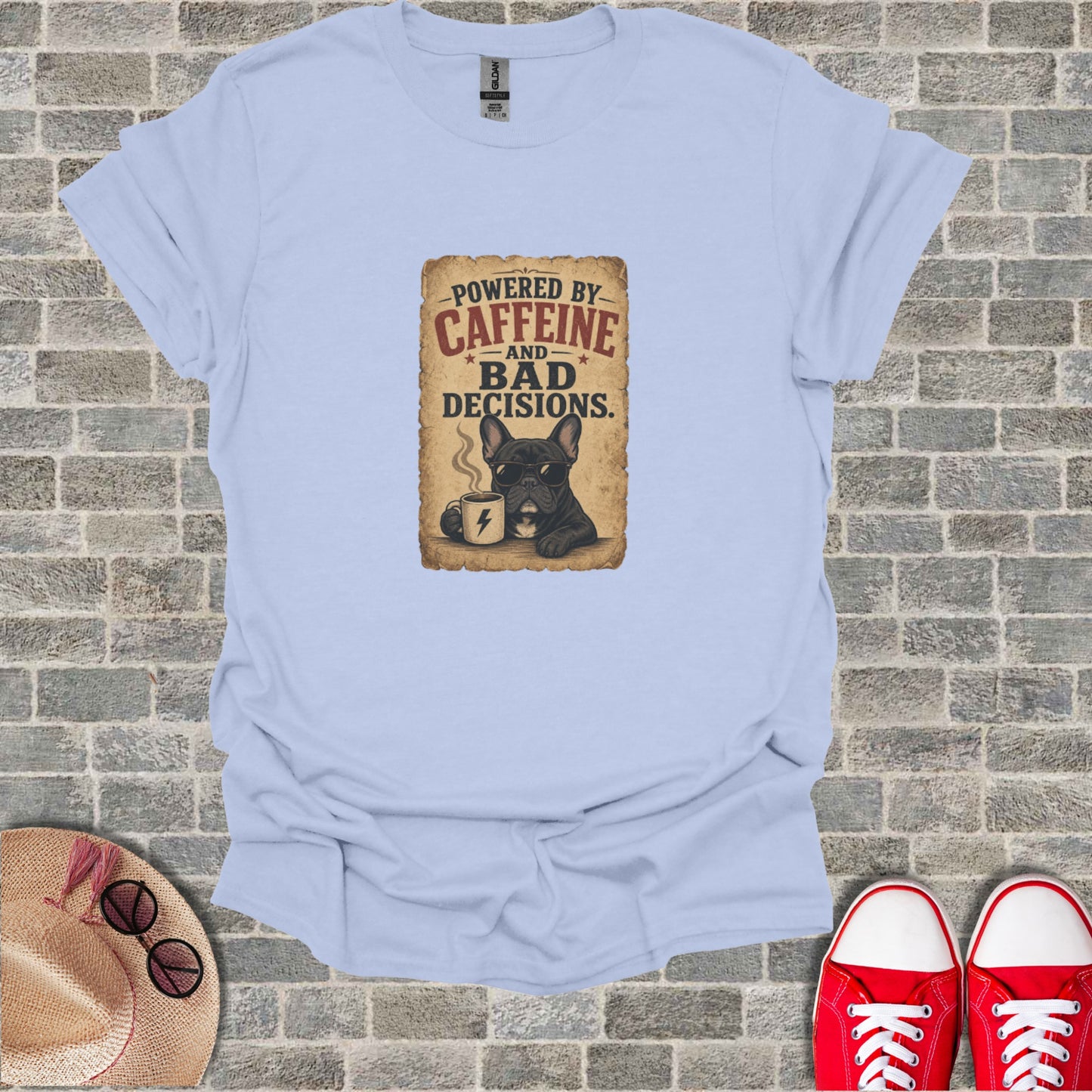 Light blue t-shirt with "Powered by Caffeine and Bad Decisions" French bulldog graphic.