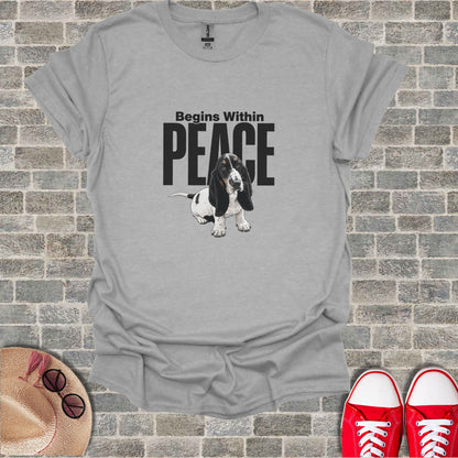 T-shirt with a basset hound and text "Begins Within PEACE".