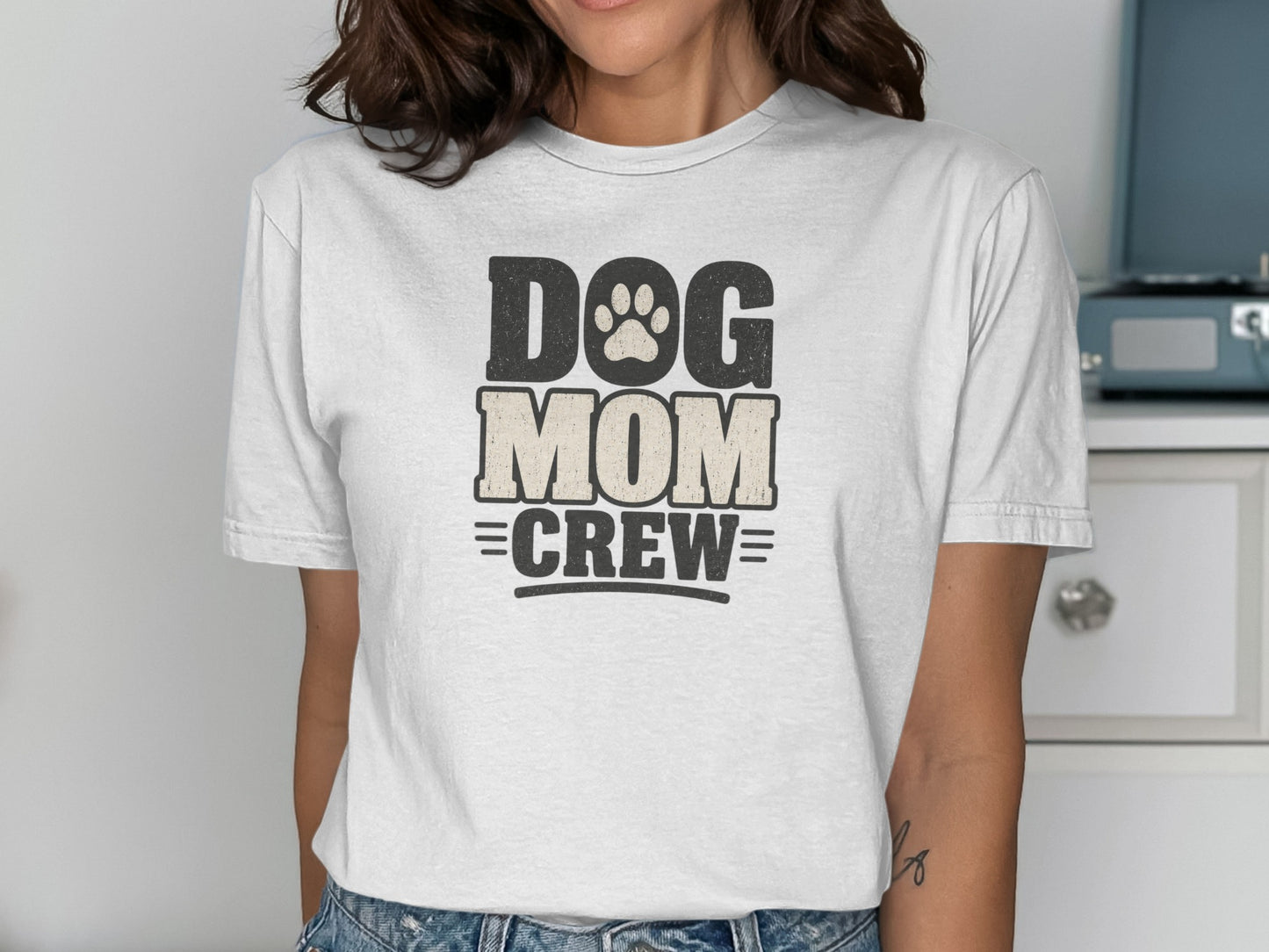 White t-shirt with "DOG MOM CREW" text and paw print graphic.