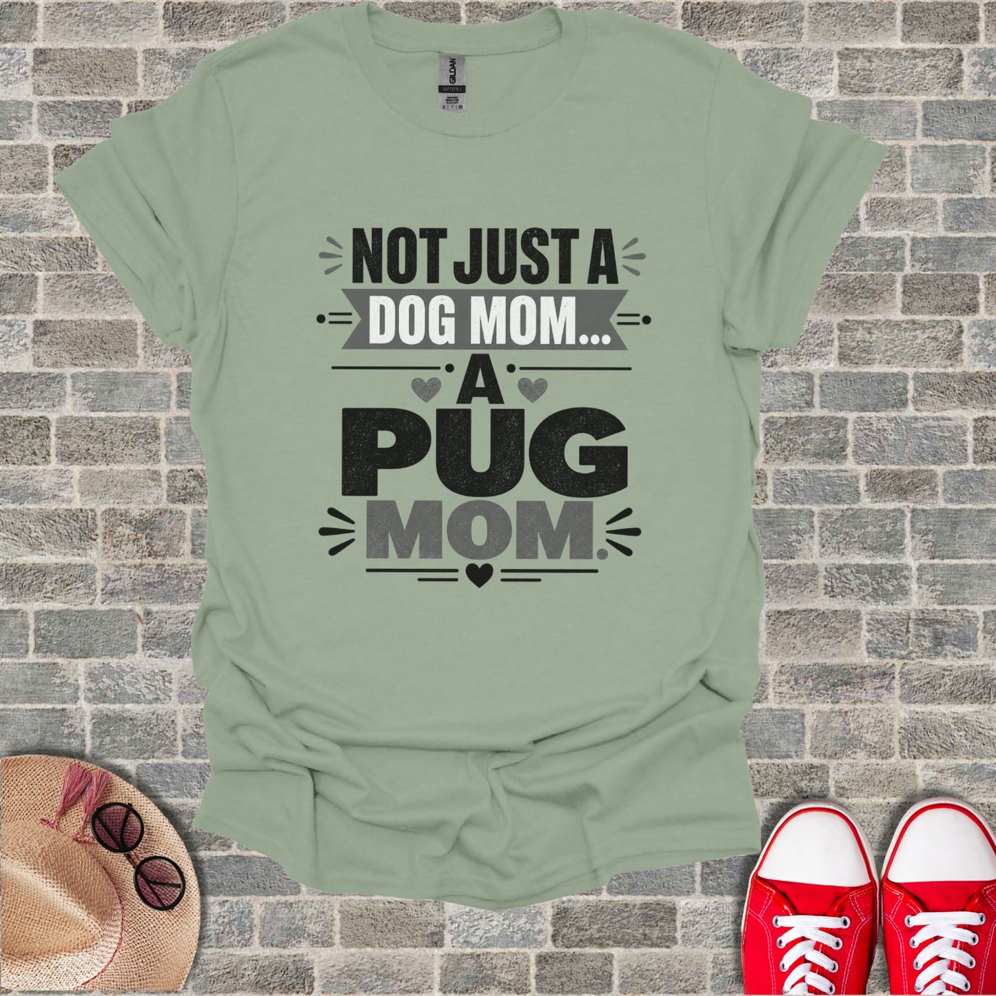 Light green t-shirt with "Not Just a Dog Mom... A Pug Mom" text.